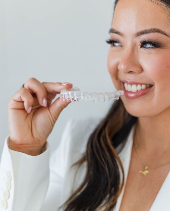 Atlee Family Dentistry Ashland, VA Dr. Alice with an Invisalign aligner (placeholder — replace with sleek-hair shot)